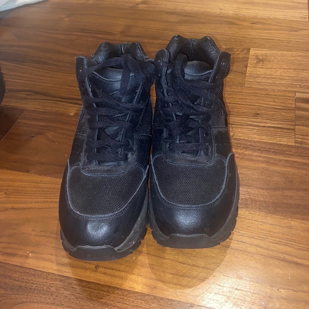 Kids black Nike ACG boots.